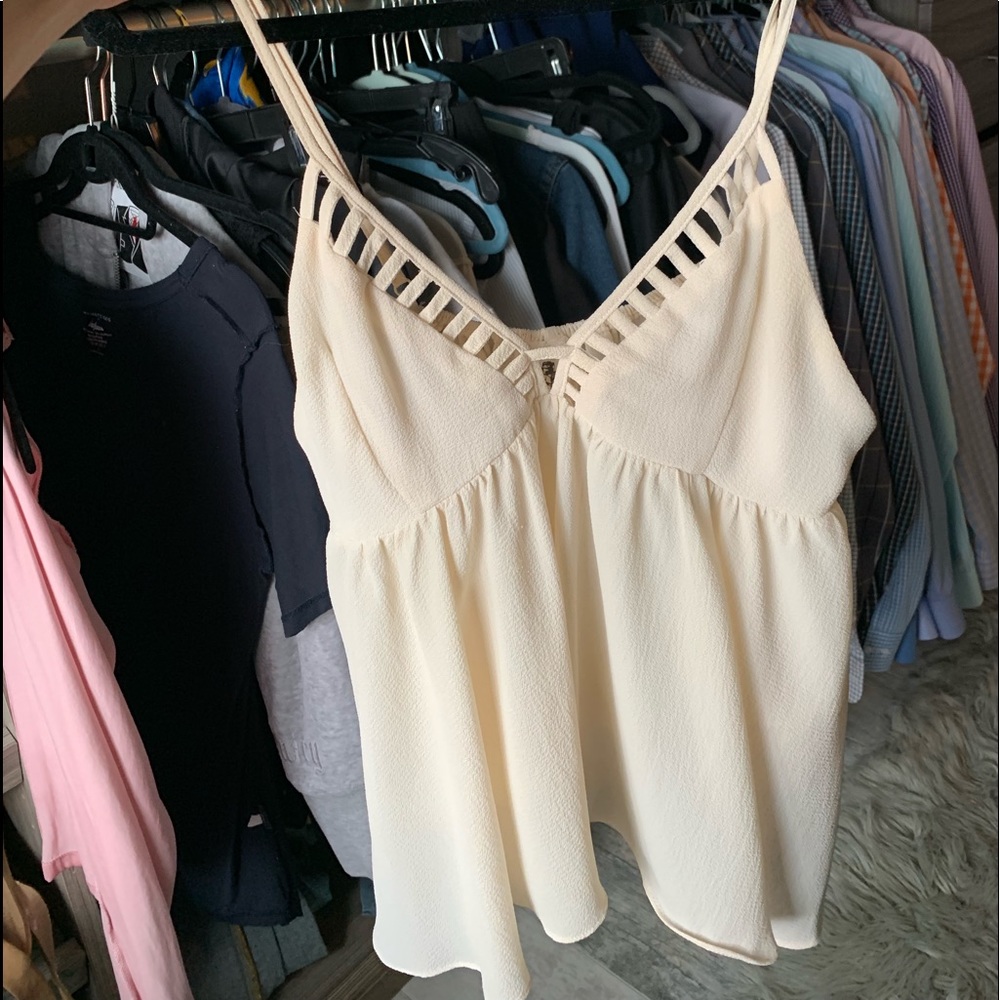 Cream sleeveless deep V festival tank with cutout